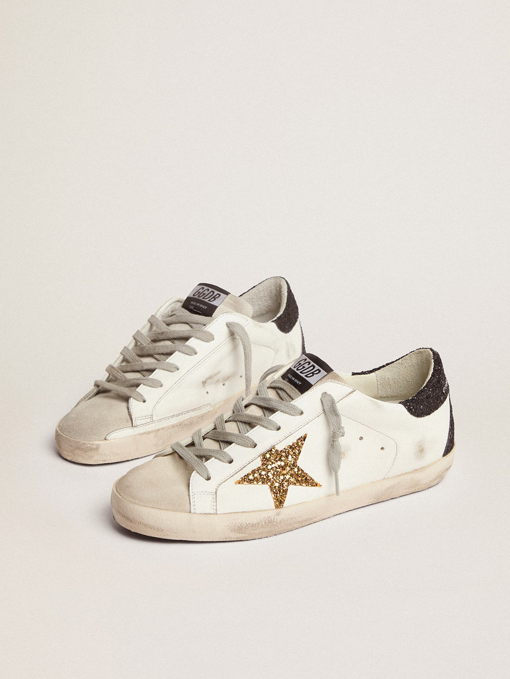 Golden goose  in nappa leather with gold glitter star and black glitter heel tab
