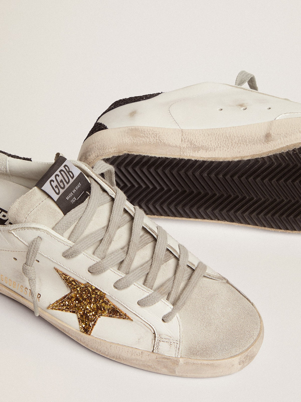 Golden goose  in nappa leather with gold glitter star and black glitter heel tab