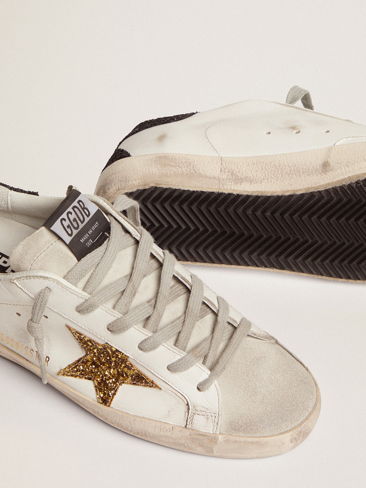 Golden goose  in nappa leather with gold glitter star and black glitter heel tab