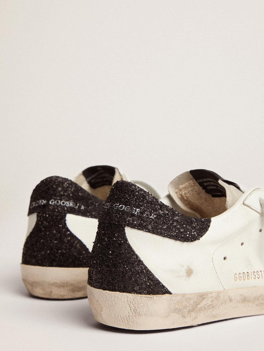 Golden goose  in nappa leather with gold glitter star and black glitter heel tab