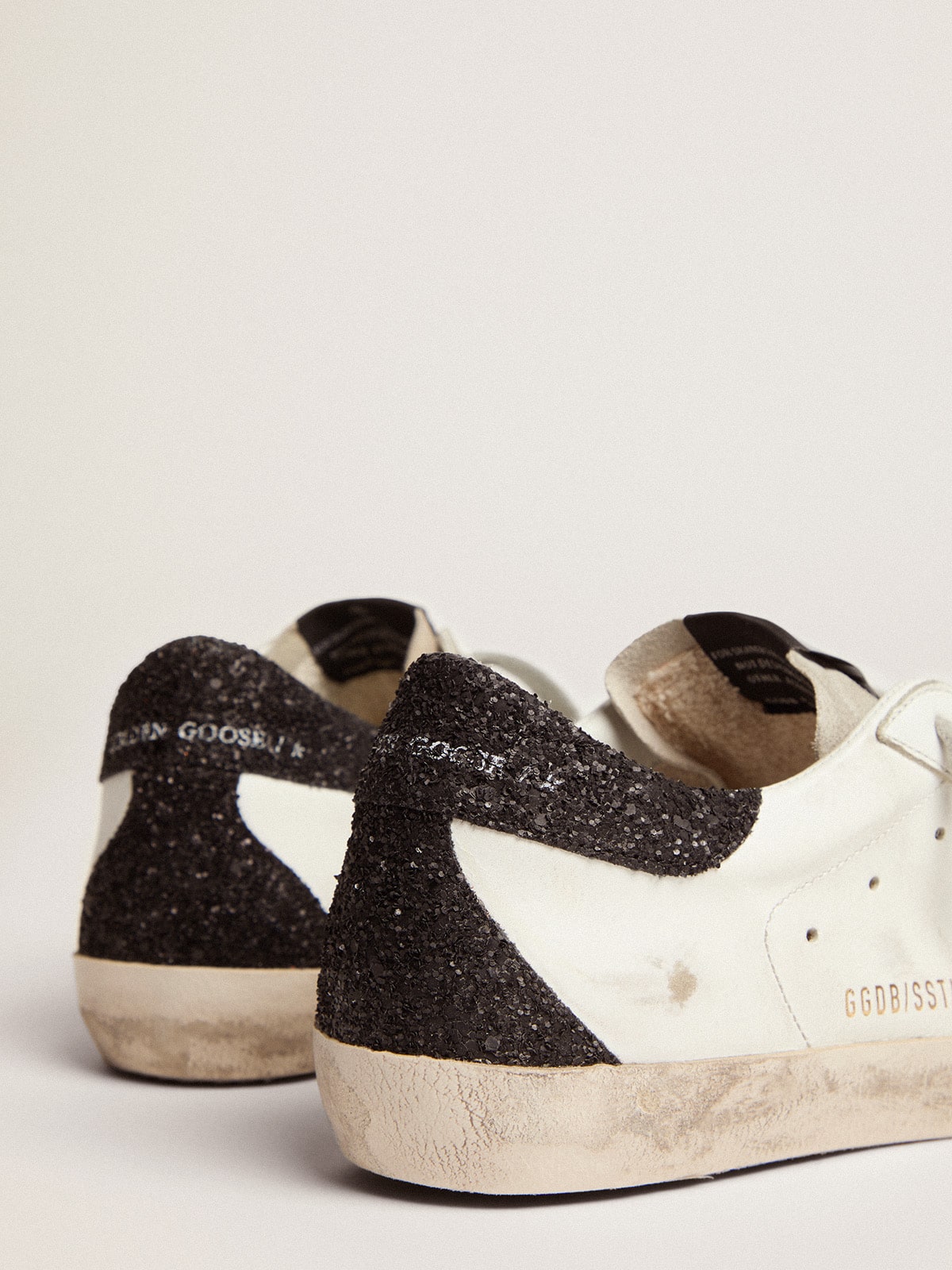 Golden goose  in nappa leather with gold glitter star and black glitter heel tab
